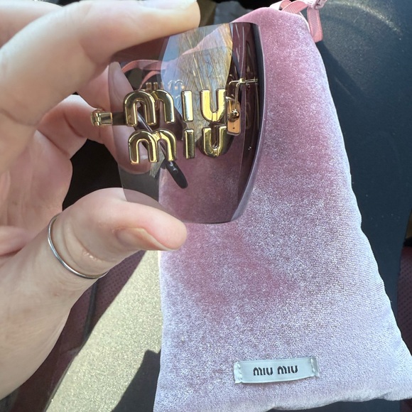 Miu Miu Rimless Sunglasses with Mauve Lenses and Gold Trim.